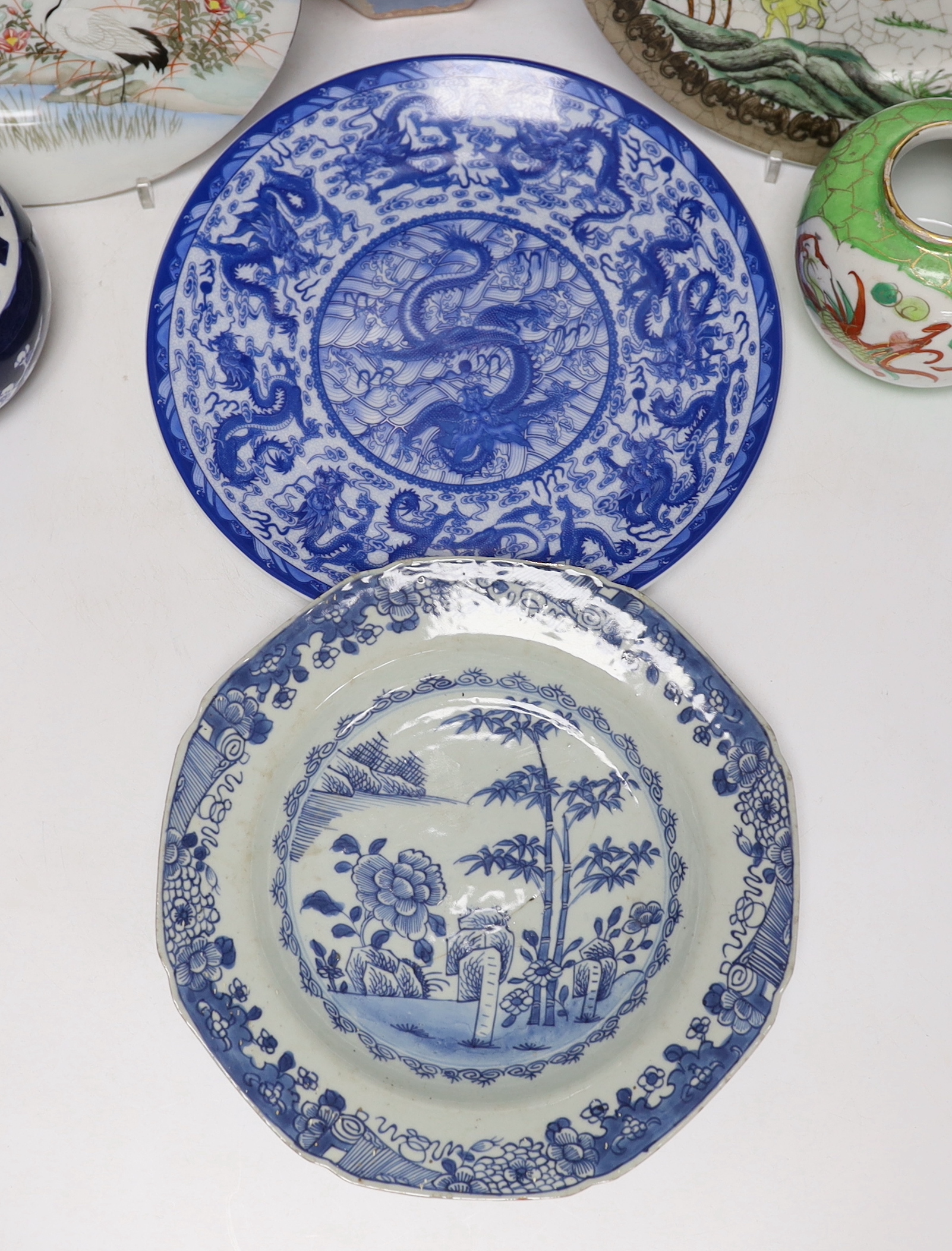 A group of Japanese and Chinese porcelain including an 18th century Chinese export dish, tallest 36cm